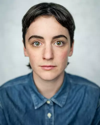 headshot of Alby Baldwin wearing a blue denim shirt