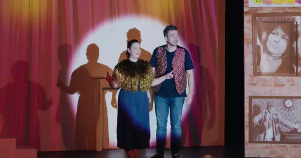 Photo of two people on stage