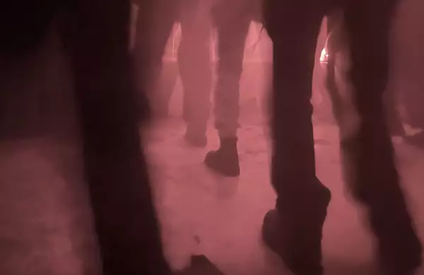 a crowd of people's legs and shoes on the dance floor