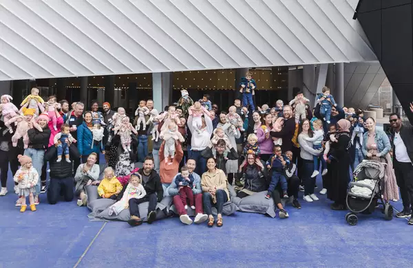 Group photo of the first breath families outside Aviva Studios