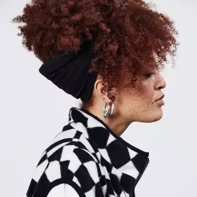 Headshot of Seren Marimba wearing a black and white top