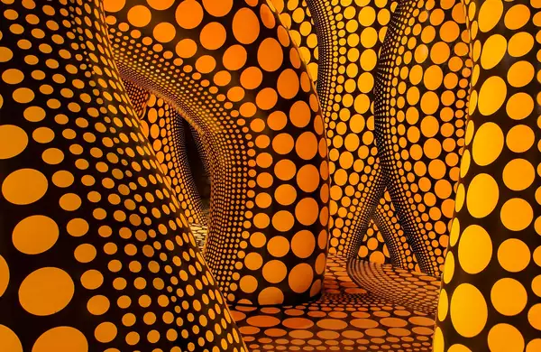 Yayoi Kusama artwork of large inflatable yellow tentacles with black polkadots on them