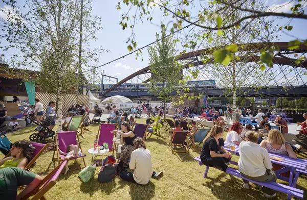 Photo of people chatting on deck chairs