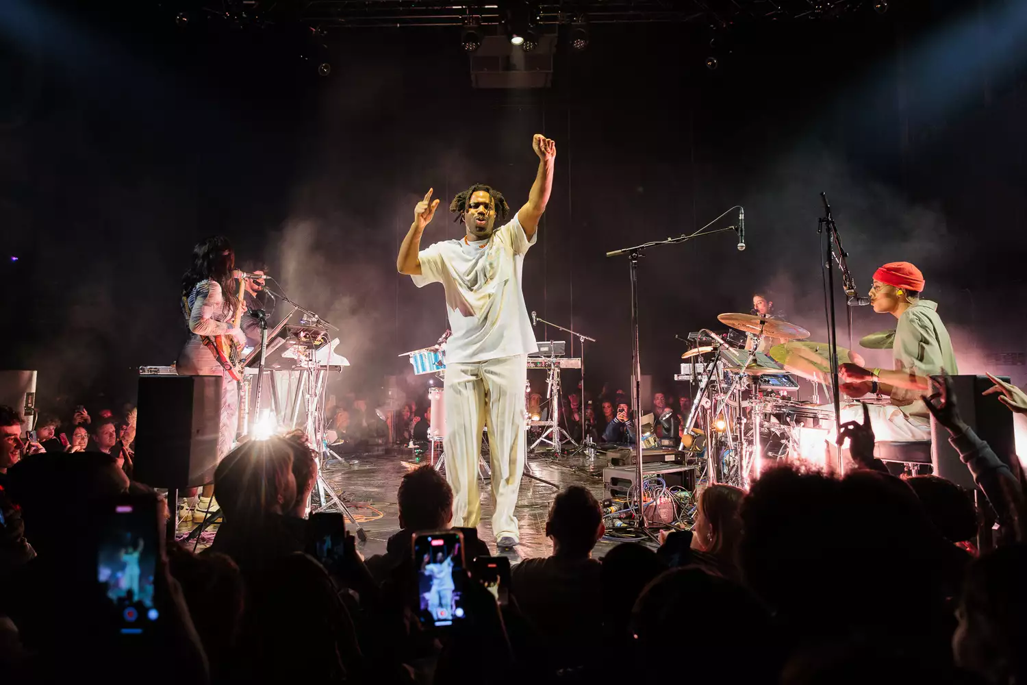 Band on stage in front of crowd