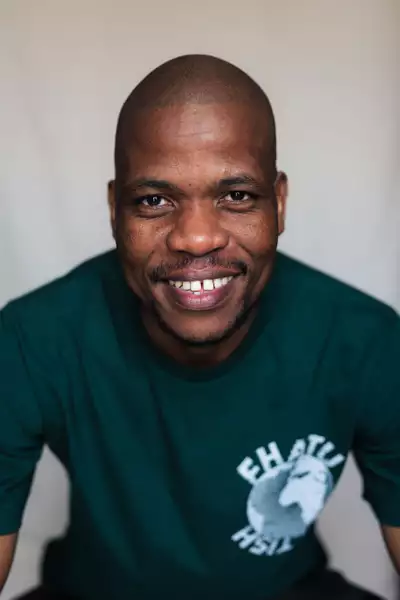 Siyambonga Alfred Mdubeki in a black logo t-shirt