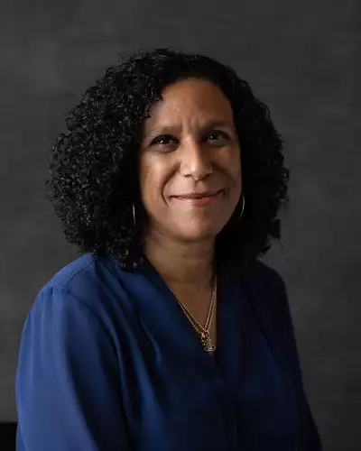 Headshot of Ayanna Thompson wearing a blue top