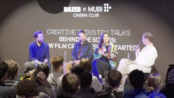Four panelists sit on stage in front of an audience at an event titled "Creative Industry Talks: Behind the Scenes" hosted by DAZED and MUBI Cinema Club, discussing how film creators get started.